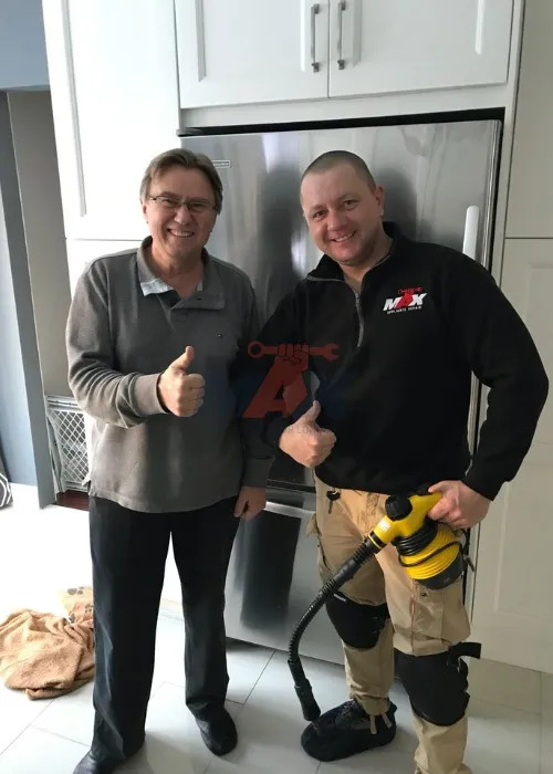 technician fixing fridge appliance sarasota